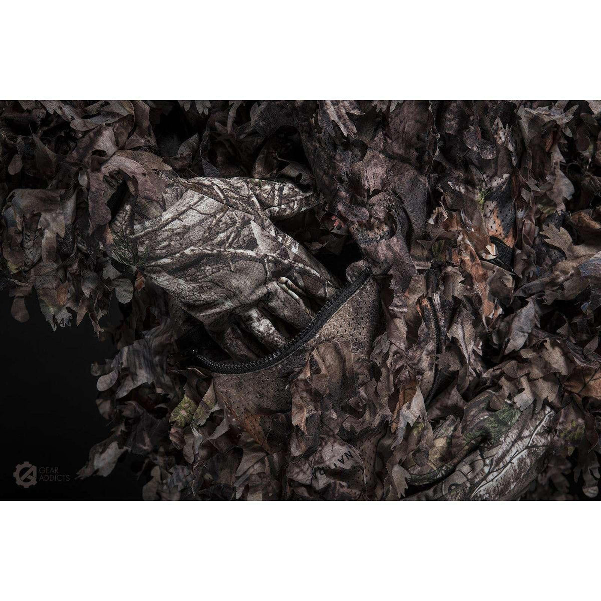 Elastic wrist cuff detail on GhillieLabs Woodland Brown 3D leafy suit breaking up human arm silhouette