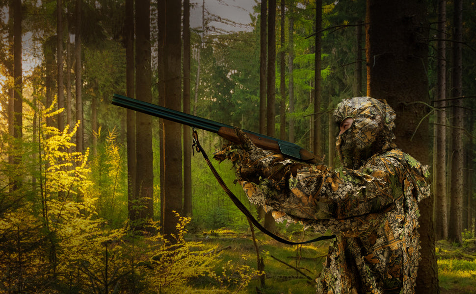 A nature researcher in dense woods tracking subjects with a camouflaged telephoto setup, maintaining full airflow via the suit’s breathable mesh base.