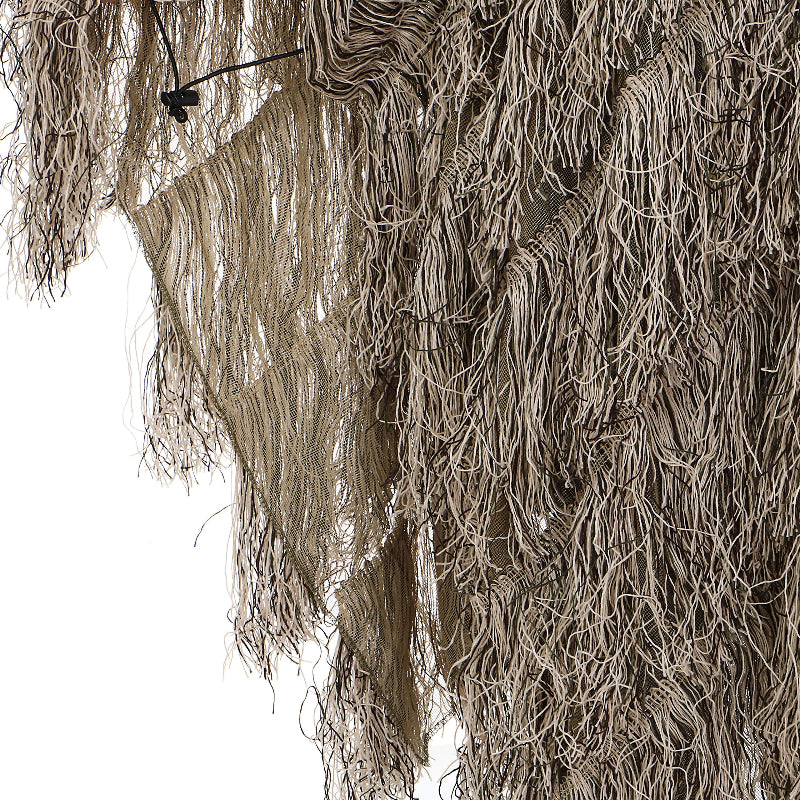 Detailed view of the breathable open-sided mesh chassis and double-stitched synthetic jute strands along the poncho hem