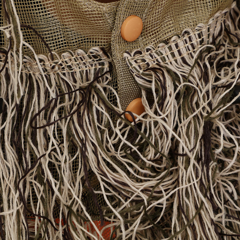 Close-up detail of the heavy-duty neckline buttons and double-stitched synthetic jute strands on the Dry Grass Ghillie Poncho.